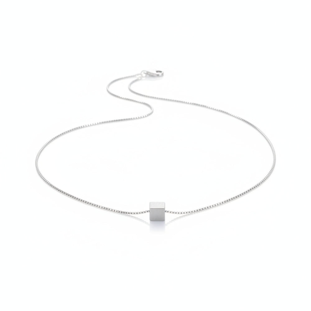 A delicate silver chain necklace with a small, polished square pendant, displayed on a clean white background.
