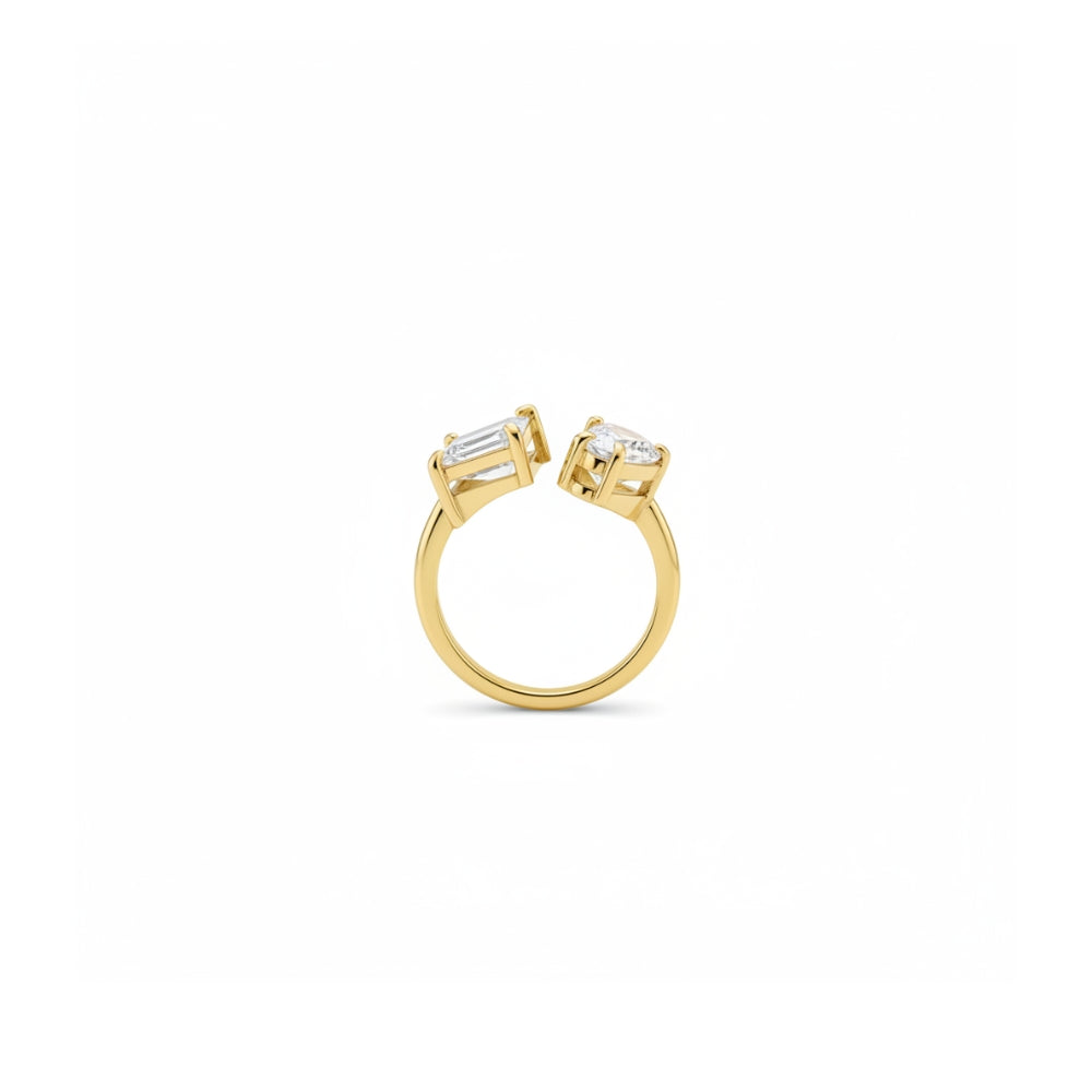A yellow gold ring with two baguette-cut clear gemstones in a prong setting, shown against a plain white background.