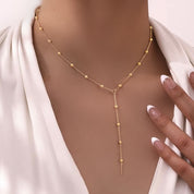 Gold bead y chain necklace 