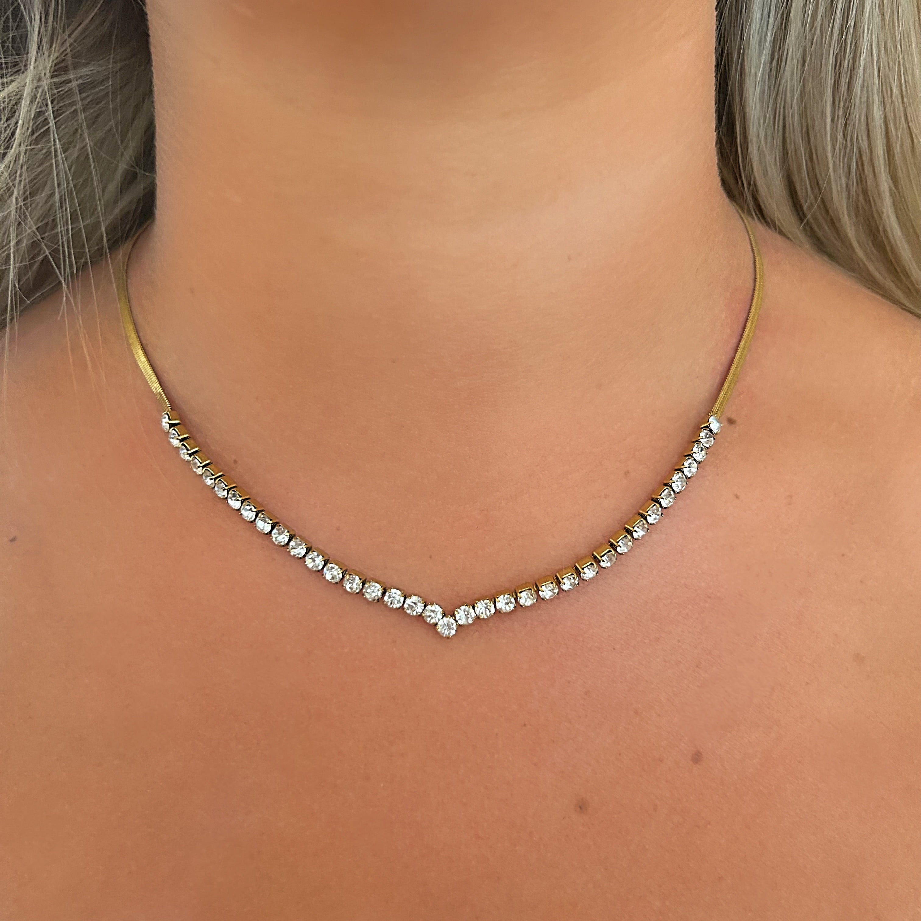 Necklace with small diamonds on a person's neck