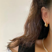 Chunky gold star huggie hoops