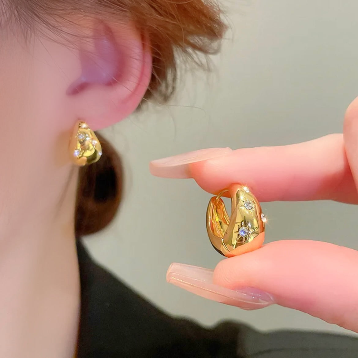 Chunky gold huggie hoops with stars