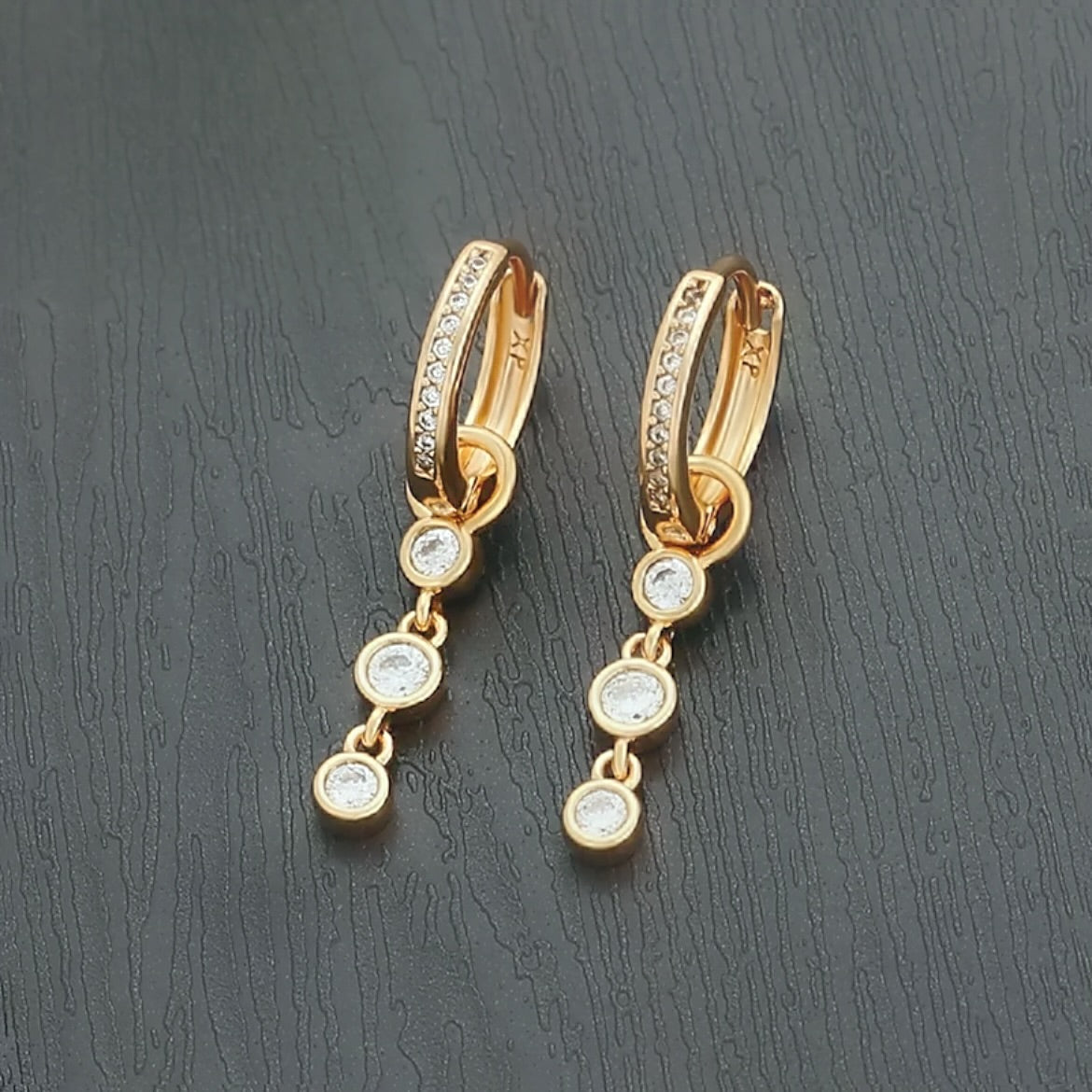 Diamond drop gold huggie earrings 
