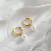 Gold Pearl huggie earrings 