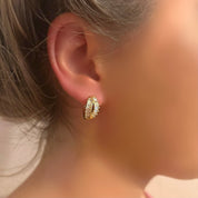 Diamond crossover gold huggie earrings