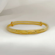 Gold angel wing bangle 