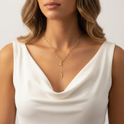 Y necklace with 2 gold stars on model in white vest