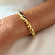 Gold angel wing bangle 