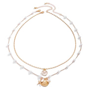 Gold shell and pearl necklaces 