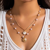 Gold shell and pearl necklaces 