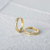 Diamond huggie earrings gold