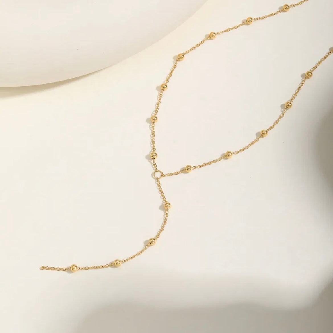 Y shaped gold bead necklace 