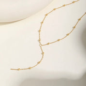 Y shaped gold bead necklace 