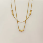 Gold bead layered necklace 