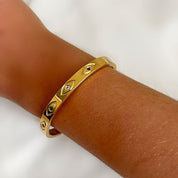 Gold evil eye bangle 