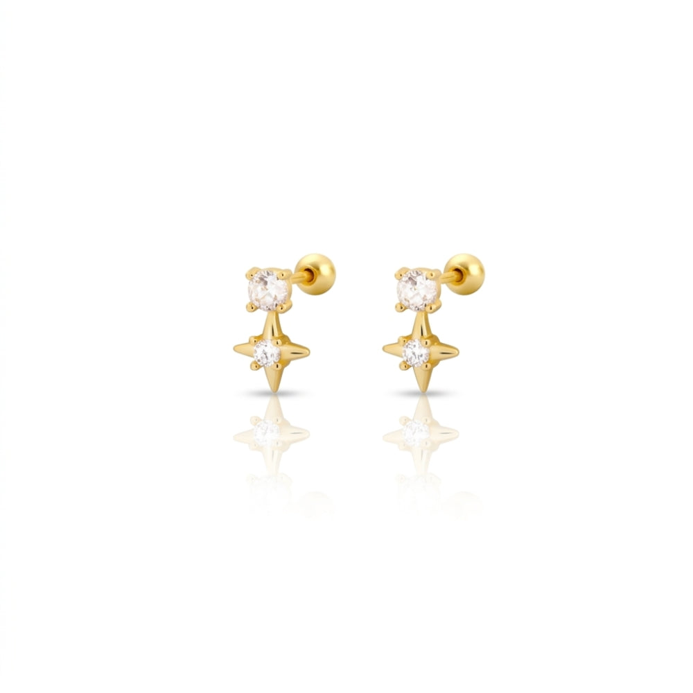 Pair of sparkling star stud earrings in gold with clear CZ crystals on a white background