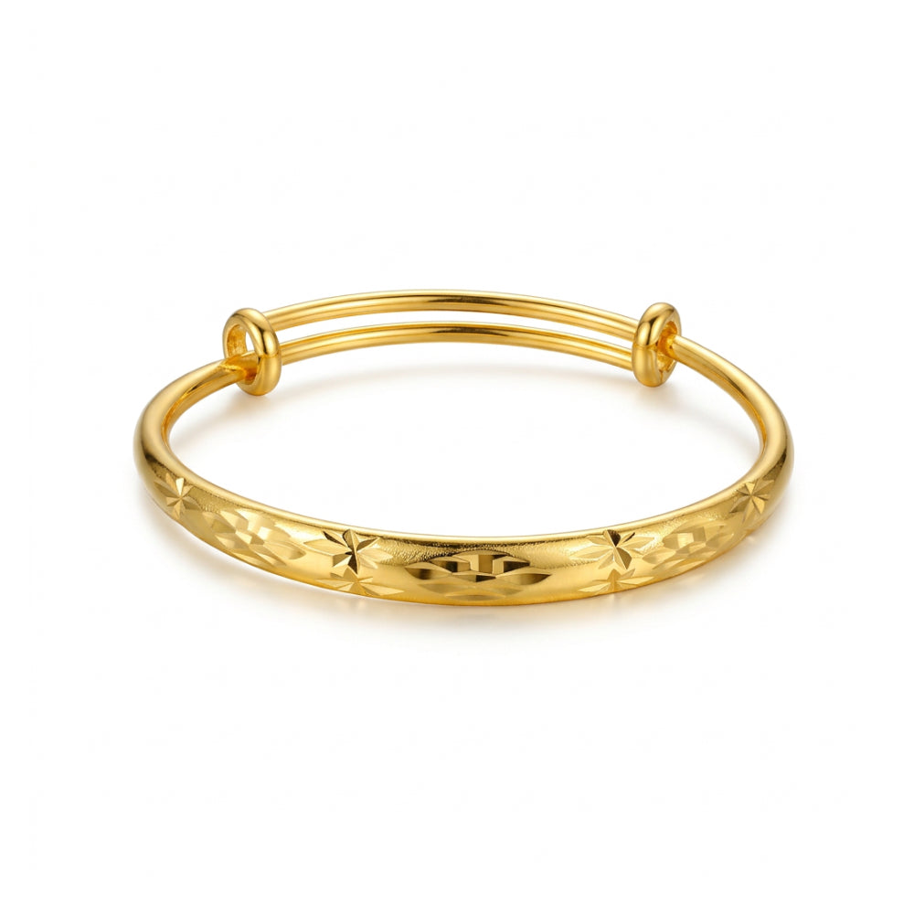 A gold-plated double-strand bangle bracelet with a textured, star-patterned outer band, shown on a clean white background.
