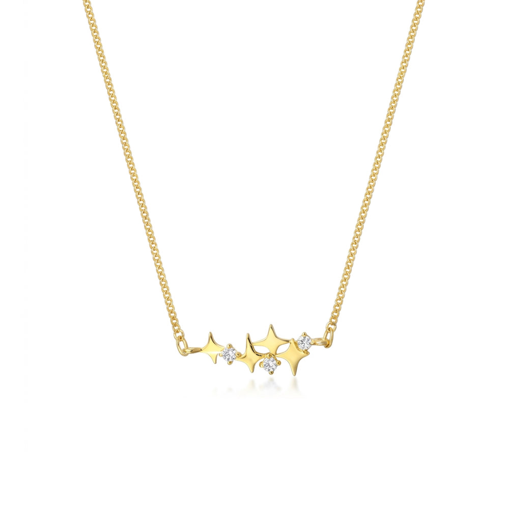 A delicate gold chain necklace featuring a horizontal bar of five small gold stars, with three of the stars accented by tiny clear gemstones, set against a solid white background.
