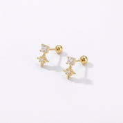 Angled view of Sparkling star earrings showing CZ crystal studs, gold stars and round ball backs 