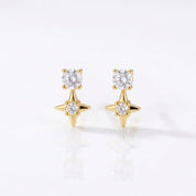 Gold star stud earrings with round CZ crystals above crystal set four point stars