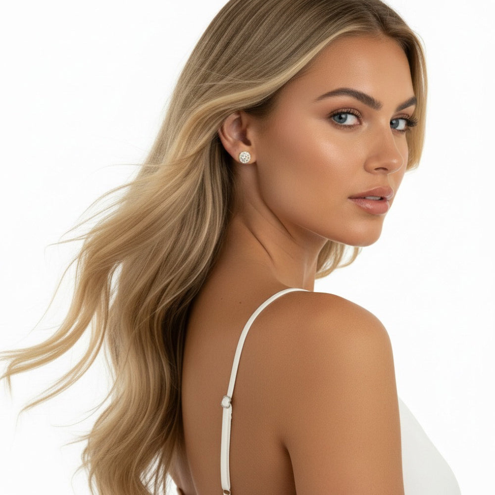 Woman wearing sparkly stud earrings