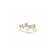 A gold ring featuring a central round white opal surrounded by small clear stones, with additional white opal stones set along curved gold branches, shown on a clean white background.