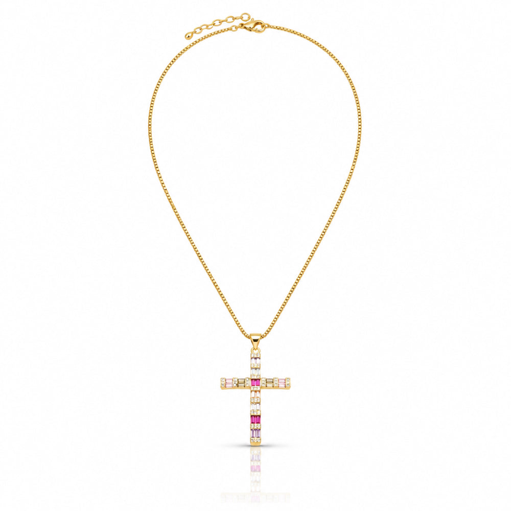 A gold cross pendant necklace adorned with clear and pink gemstones, suspended from a delicate gold chain on a white background.