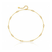 Gold necklace with spaced clear teardrop crystals 
