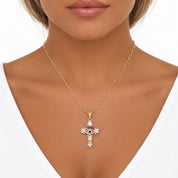 Front view of a model wearing the gold-tone evil eye cross necklace, showing the chain length and pendant placement.