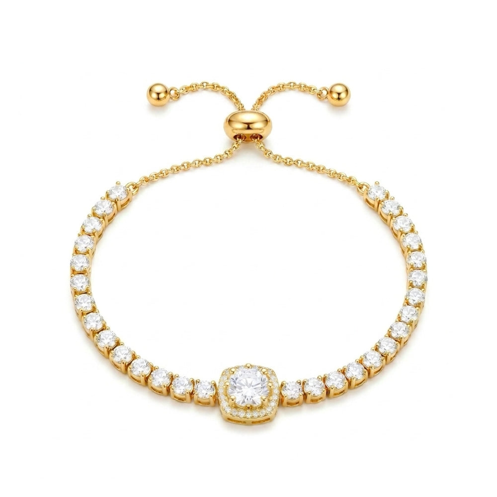 A gold-plated tennis bracelet featuring a central round diamond surrounded by a halo, with a row of small round diamonds along two curved bands, finished with an adjustable sliding clasp.