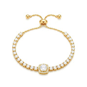A gold-plated tennis bracelet featuring a central round diamond surrounded by a halo, with a row of small round diamonds along two curved bands, finished with an adjustable sliding clasp.