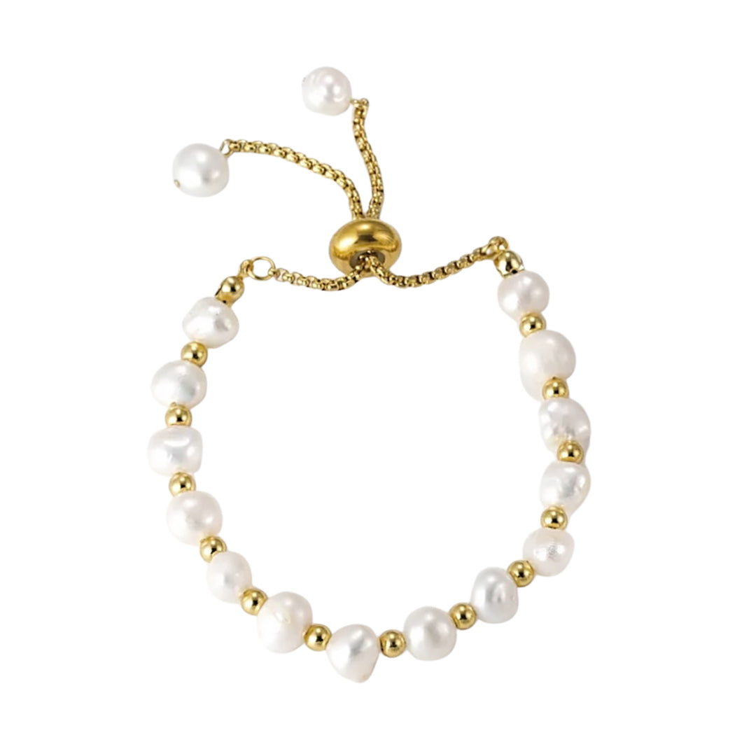 Pearl bracelet with gold accents on a white background