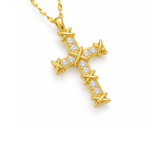 A gold cross pendant necklace featuring a barbed wire design and small clear stones, shown on a white background.