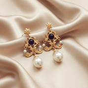 Vintage Pearl Earrings on champagne beige satin