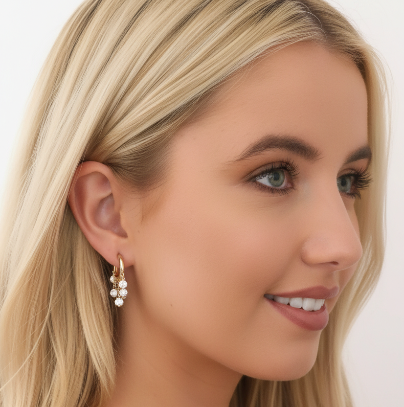 Woman modelling Diamond Dangle Huggie Earrings