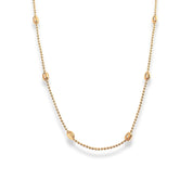 Delicate gold chain dotted with beads